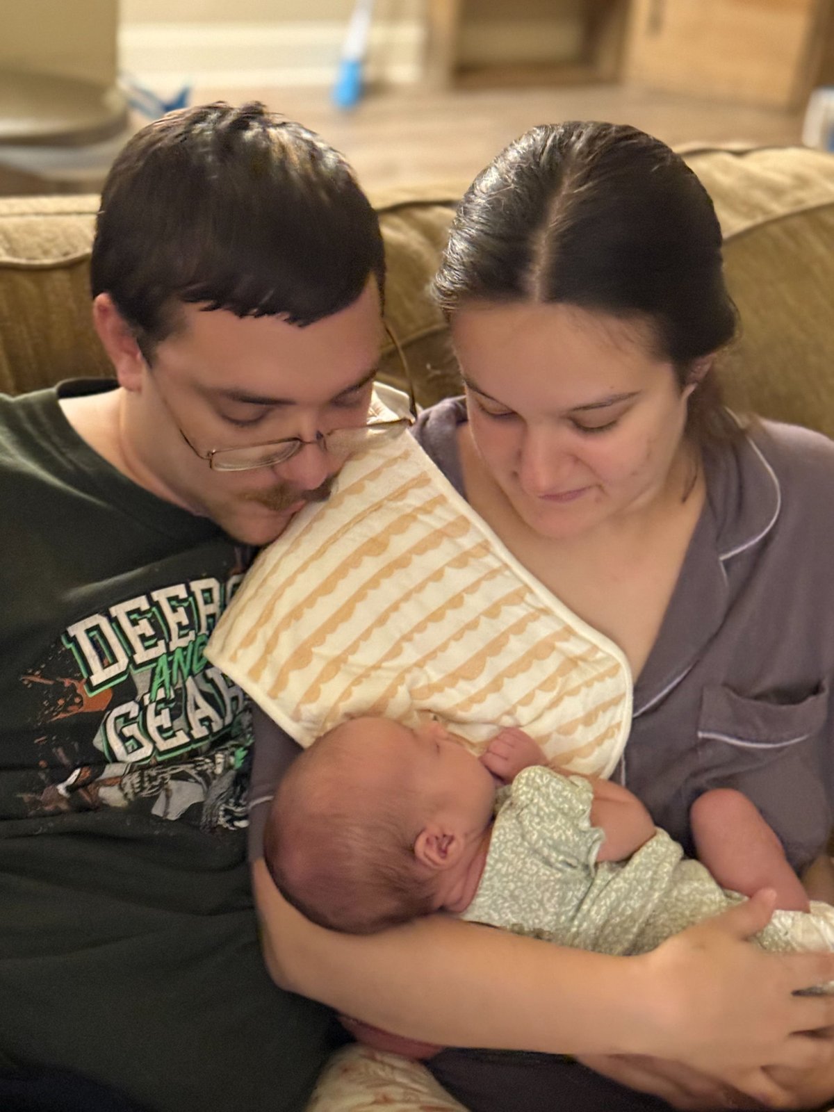 An MHN family at home with their newborn baby