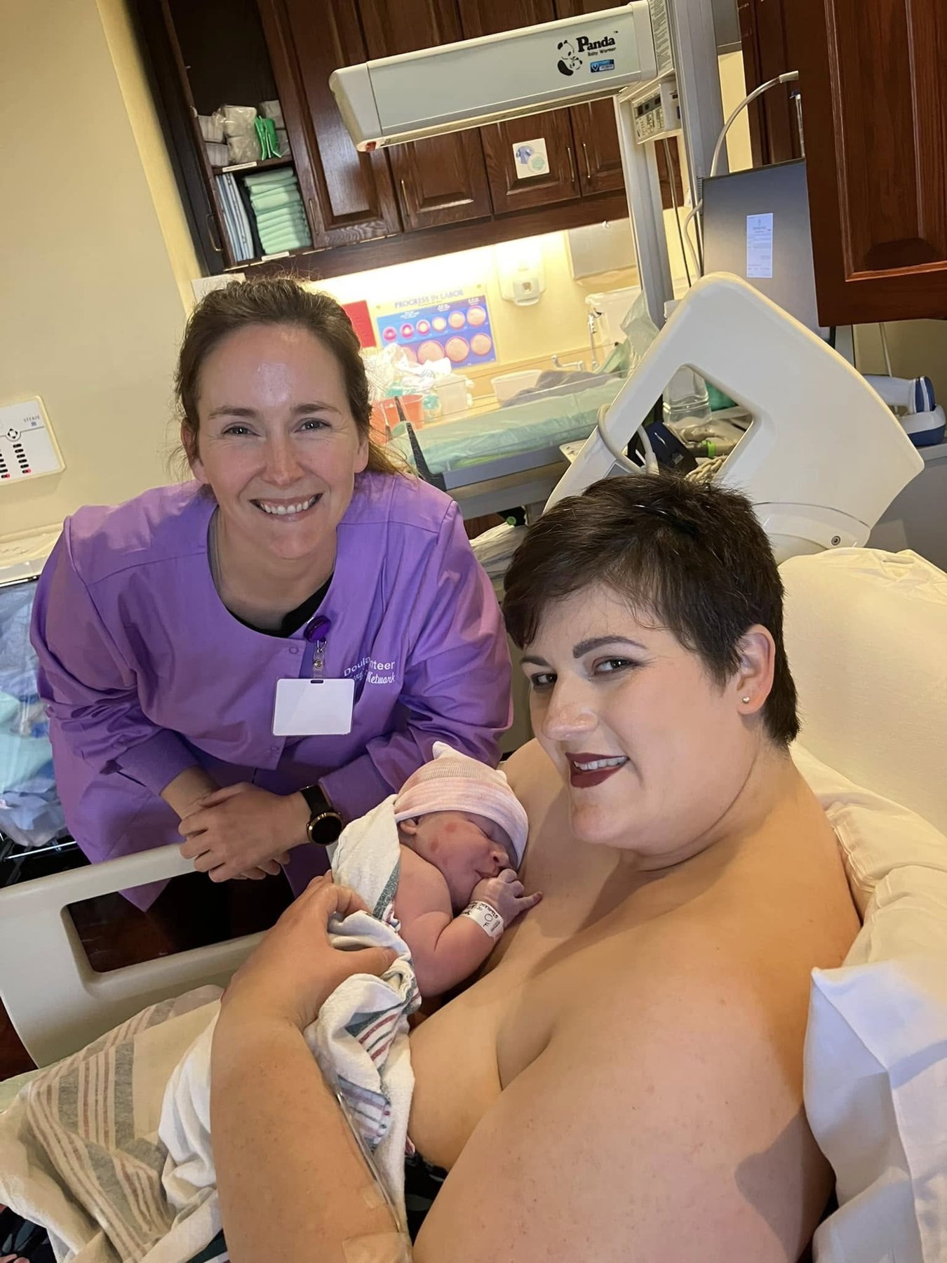 An MHN doula with a mother and her newborn