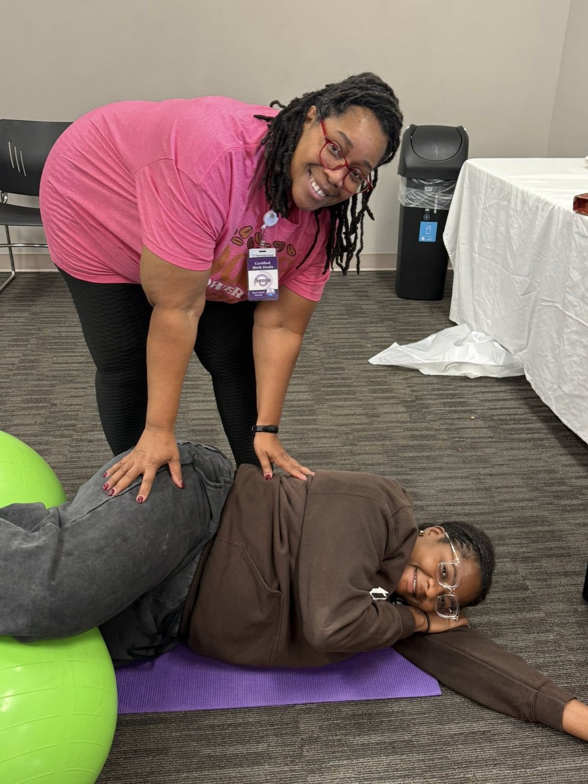 An MHN trainer coaching a trainee through a comfort technique